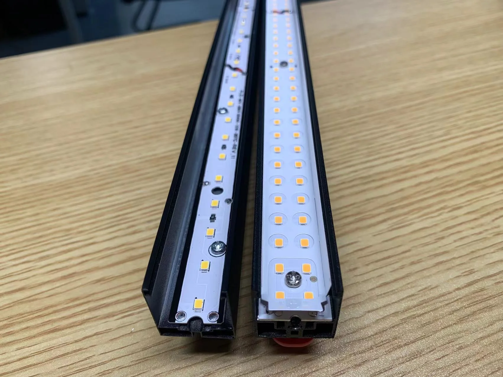 Comparison of single-row vs double-row LED layout inside a magnetic track light module with diffuser removed